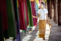 Thai girl in traditional lanna costume travel in  lamduan woven cloth Royalty Free Stock Photo