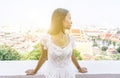 Thai girl with white dress on a temple balcony