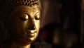 Thai golden buddha face statue close up for light side and dark side of Thailand Royalty Free Stock Photo