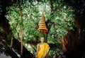 Thai golden Buddha statue with many-tiered umbrella. Royalty Free Stock Photo