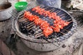 Thai grilled porks on grate Royalty Free Stock Photo