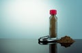 Thai herbal powders snuff in transparent glass bottle with red cap and snuff tube. Brown powders with blank label in bottle Royalty Free Stock Photo