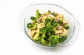 Thai homemade food, stir-fried broccoli with tofu and ground pork, food in a clear glass bowl on white background Royalty Free Stock Photo