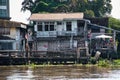 Thai houses with traditional architecture, signs, symbols on the Chao Phraya riverbank