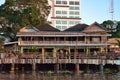 Thai houses with traditional architecture, signs, symbols on the Chao Phraya riverbank