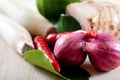 Thai ingredients, galangal, lime and chili Royalty Free Stock Photo