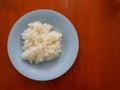 Thai jasmine rice, a number of white steamed rice on a blue plate