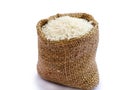 Thai jasmine rice in sack, white rice on burlap sack background