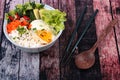 Thai jasmine rice topped soft boil eggs and fried herb. Royalty Free Stock Photo