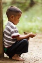 Thai kid holding little bird