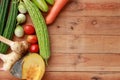 Thai kitchen. Various vegetables, spices and Ingredients with blank note page and pencil on wooden background. Top view with copy