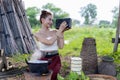 Thai lady beautiful dressing traditional northern style listening radio music from transistor a have happy joyful smiling in rice