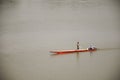 Thai and laos people riding long tail boat for catch fishing in Mekong river Royalty Free Stock Photo