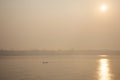 Thai and laos people riding long tail boat for catch fishing and reflection light surface water of Mekhong River and lighting of Royalty Free Stock Photo