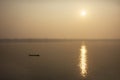 Thai and laos people riding long tail boat for catch fishing and reflection light surface water of Mekhong River and lighting of Royalty Free Stock Photo