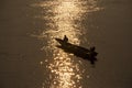 Thai and laos people riding long tail boat for catch fishing and reflection light surface water of Mekhong River and lighting of Royalty Free Stock Photo