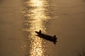 Thai and laos people riding long tail boat for catch fishing and reflection light surface water of Mekhong River and lighting of Royalty Free Stock Photo