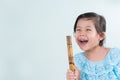 Thai Little Cute Girl in Traditional Dress Playing Thai Bamboo F Royalty Free Stock Photo