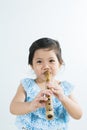 Thai Little Cute Girl in Traditional Dress Playing Thai Bamboo F Royalty Free Stock Photo