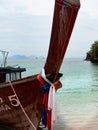 Thai Longtail Boat Docked on a Tropical Beach in Thailand