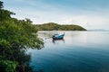 Thai Longtail Fishing Boat at Koh Tean mangrove forest near Samui island in summer day with blue sky