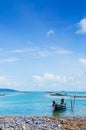 Thai Longtail Fishing Boat at Koh Tean near Samui island in summer day with blue sky