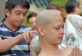 An Thai male sit for ordain ritual with his family