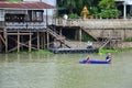 Thai man or fisher people sailing plastic long tail and paddle boat fishery floating catch fishing marine and fish in chao phraya