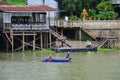 Thai man fisher people sailing plastic paddle long tail boat fishery floating catch fishing marine and fish in chao phraya river Royalty Free Stock Photo