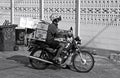 Thai man on loaded motorbike