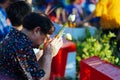 A Thai man prays during Songkhran celebration