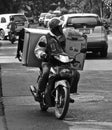 Thai man transporting a fridge