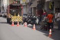 Thai man working mark line thermoplastic traffic routes on the road