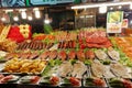 At the Thai market, ready-made seafood is displayed in close-up.