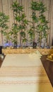 Thai massage salon, vertical photo of the interior of the massage area with Mat, candles, bamboo, the concept of relaxation and Royalty Free Stock Photo