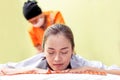 Woman getting traditional Thai stretching massage. Healing shiatsu massage.