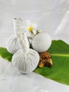 Thai massage with thai herbs on banana leaf and flower