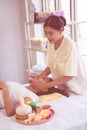 Thai Massage Therapist giving head and facial massage to an Asian woman in Thai traditional spa Royalty Free Stock Photo