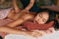 Thai Massage. Woman Having Relaxation Back Massage At Spa Salon Royalty Free Stock Photo