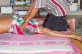 Thai massagist doing massage
