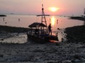 2014, KO-PHA-NGAN, THAILAND - Thai men picking up seashells for dinner at sunset