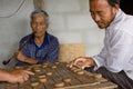 Thai men are playing Chinese chess - XiangQi Royalty Free Stock Photo