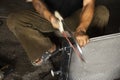 Thai men technician professional people use manual hand steel saw tools for cutting steel cover of car radiator and repairs