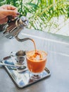 Thai milk tea ice cubes in glass Royalty Free Stock Photo