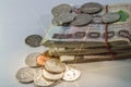 Thai Money, 1000 baht banknotes and coin on white background with light ray.