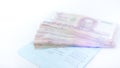 Thai money banknotes 1000 baht and book bank on white background, business investment concept .Selective focus Royalty Free Stock Photo