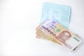 Thai money banknotes 1000 baht and book bank on white background, business investment concept .Selective focus Royalty Free Stock Photo