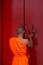 Thai monk and buddhist temple gate