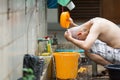 Thai monk clean a head of man by water after hair shave for ordination ceremony in buddhist in Thailand