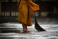 Thai monk daily cleaning in buddist temple